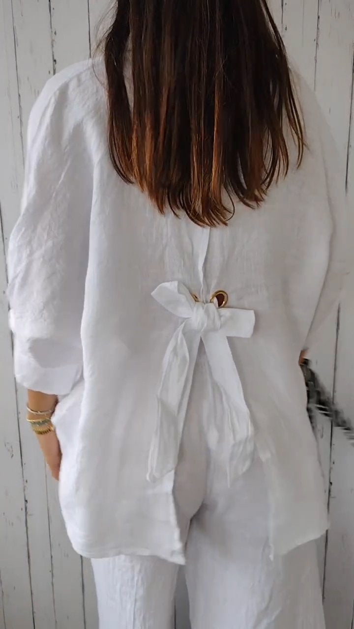 Elarine – Verfijnde damesblouse met open rug en strikdetail